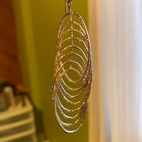 Striking 3” drop gold earrings with diamond cut, interlocking rings. - Picture 2 of 3